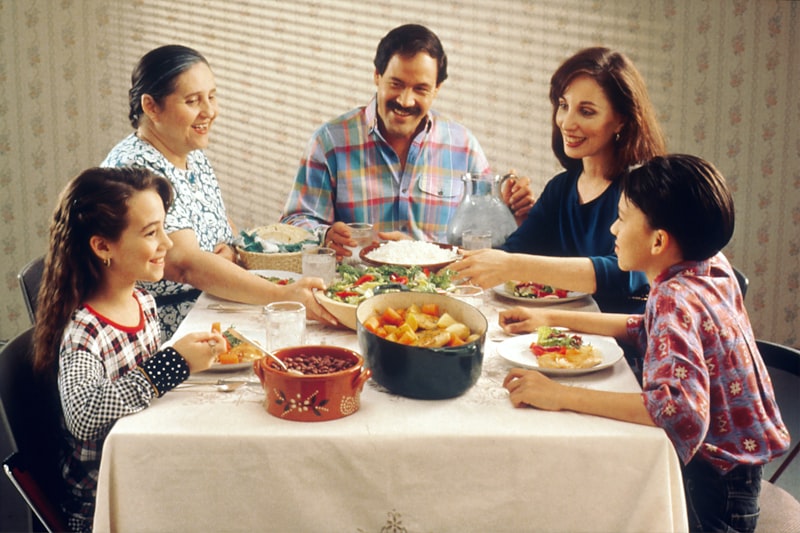 Mexican family reviewing their household budget at home
